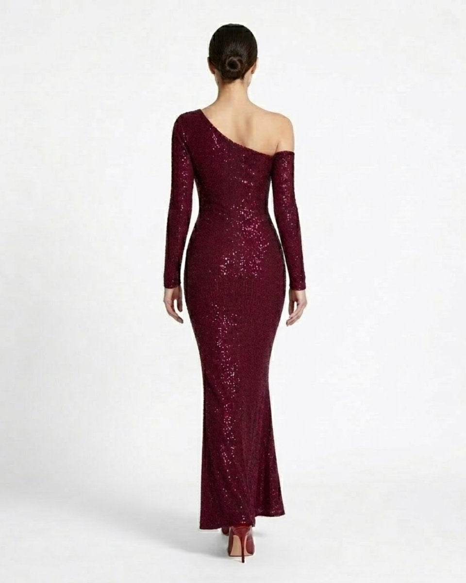 Back view of the Fenlo  formal mermaid prom dress showing off-the-shoulder sleeve detail and floor-length hem.