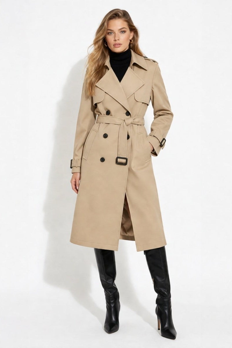 Front view of female model wearing a classic khaki double-breasted trench coat with dark buttons and belted waist