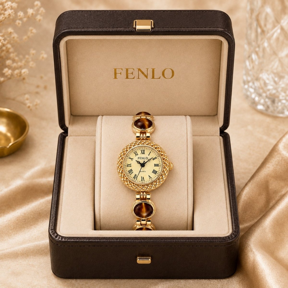 luxury women's vintage style watch with a brown tiger's eye stone bracelet displayed inside a high-end textured leather boutique box.