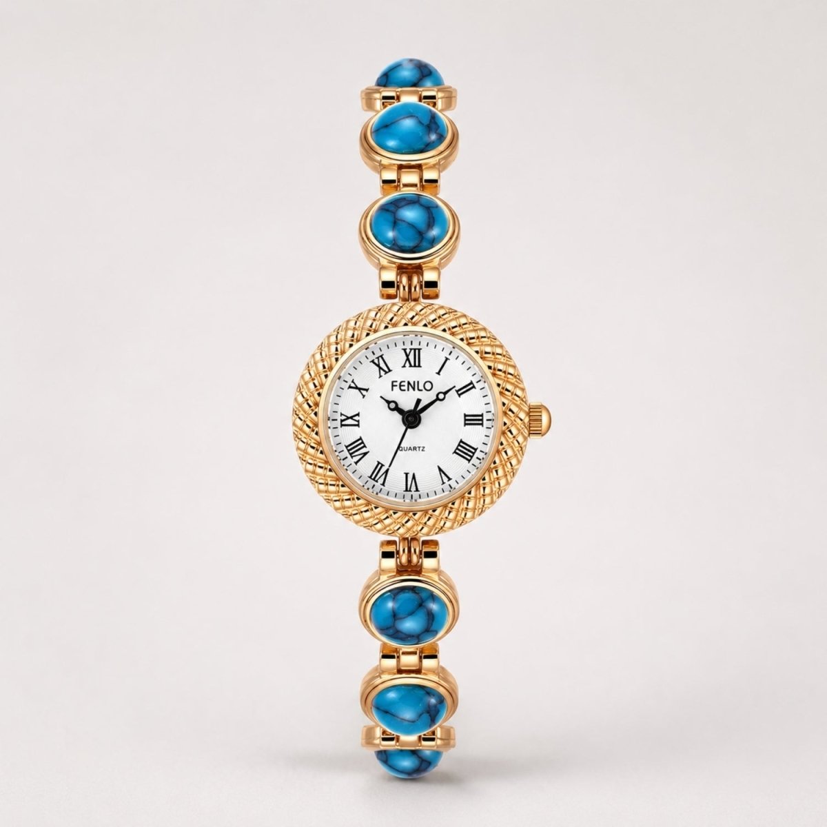 Studio front view of the women's gold statement watch highlighting bright blue turquoise stones and a crisp white Roman numeral dial.