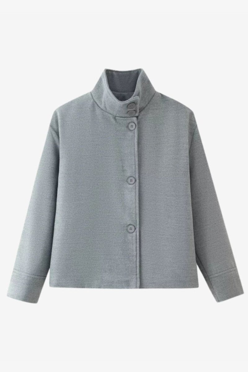 A light gray cropped jacket with a high stand collar and three-quarter sleeves, featuring a buttoned front closure, shown against a plain light gray background.