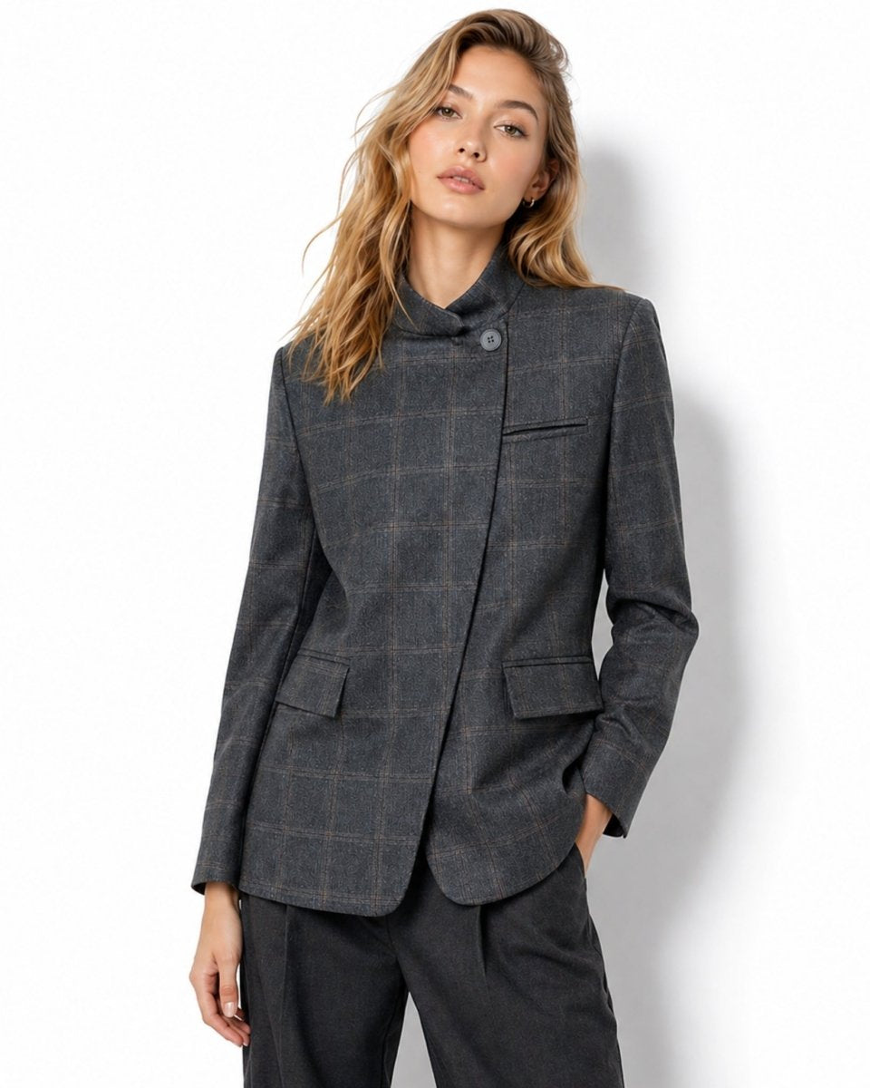 Front view of female model wearing the grey plaid asymmetric stand collar tailored blazer jacket.