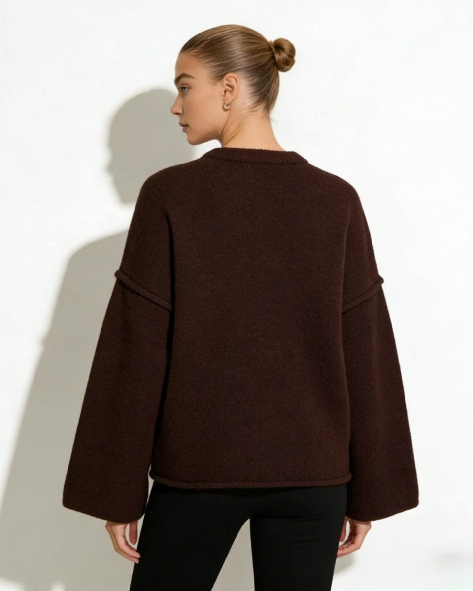 Back view of the oversized boiled wool sweater showing its boxy fit.
