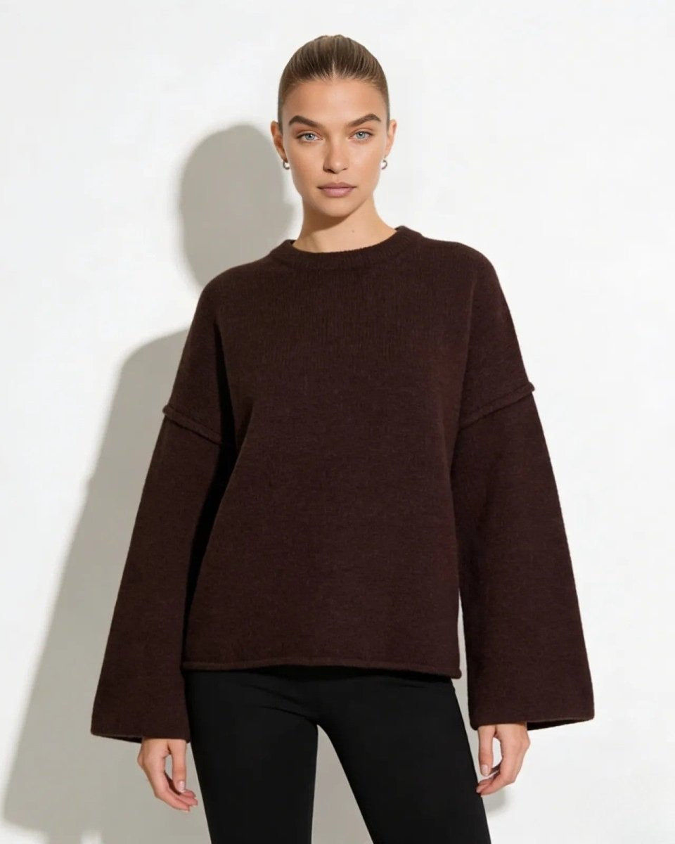 Model wearing the oversized boiled wool sweater in dark brown, front view.