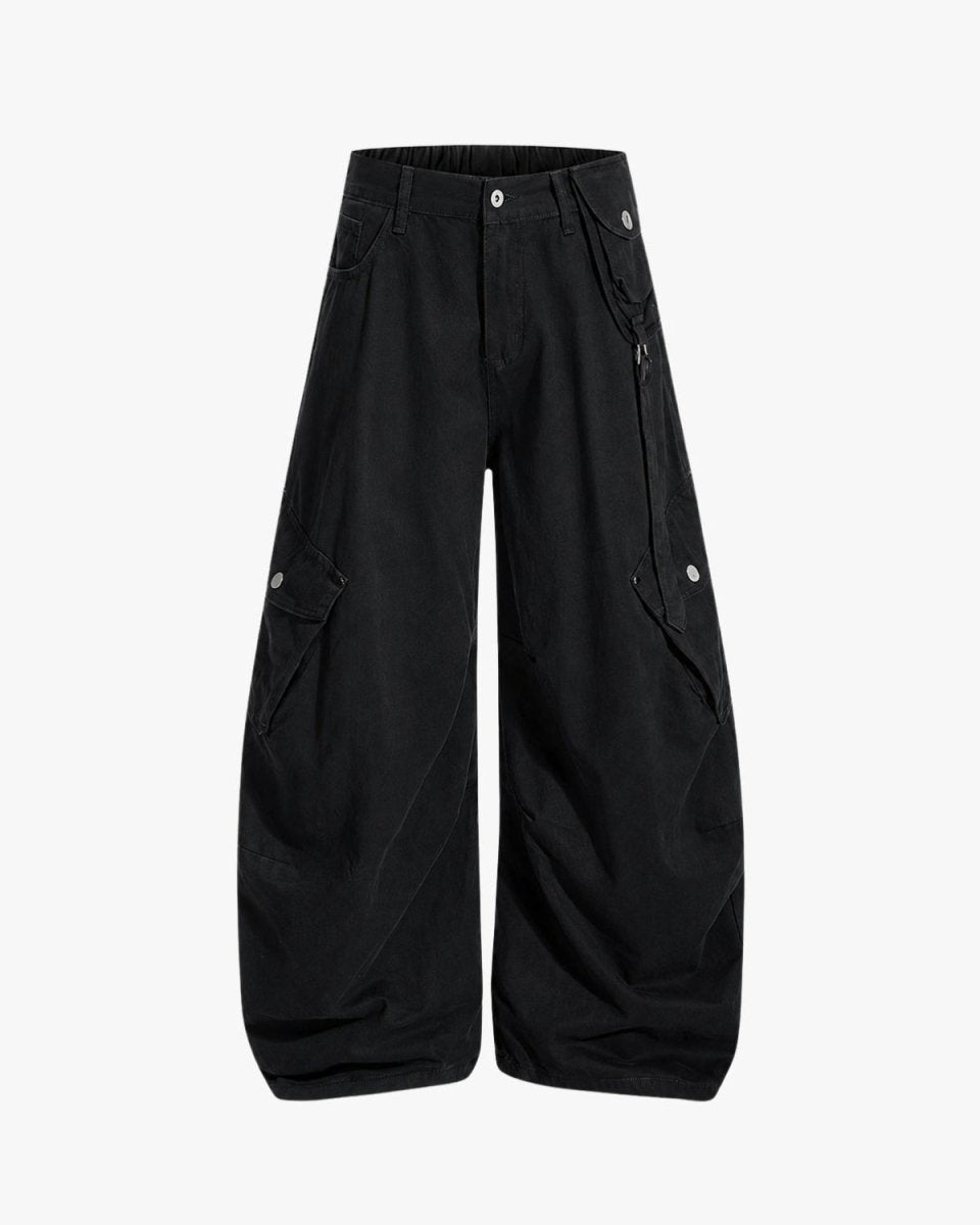 Black wide-leg cargo pants with multiple utility pockets and silver snap details, shown against a plain white background.