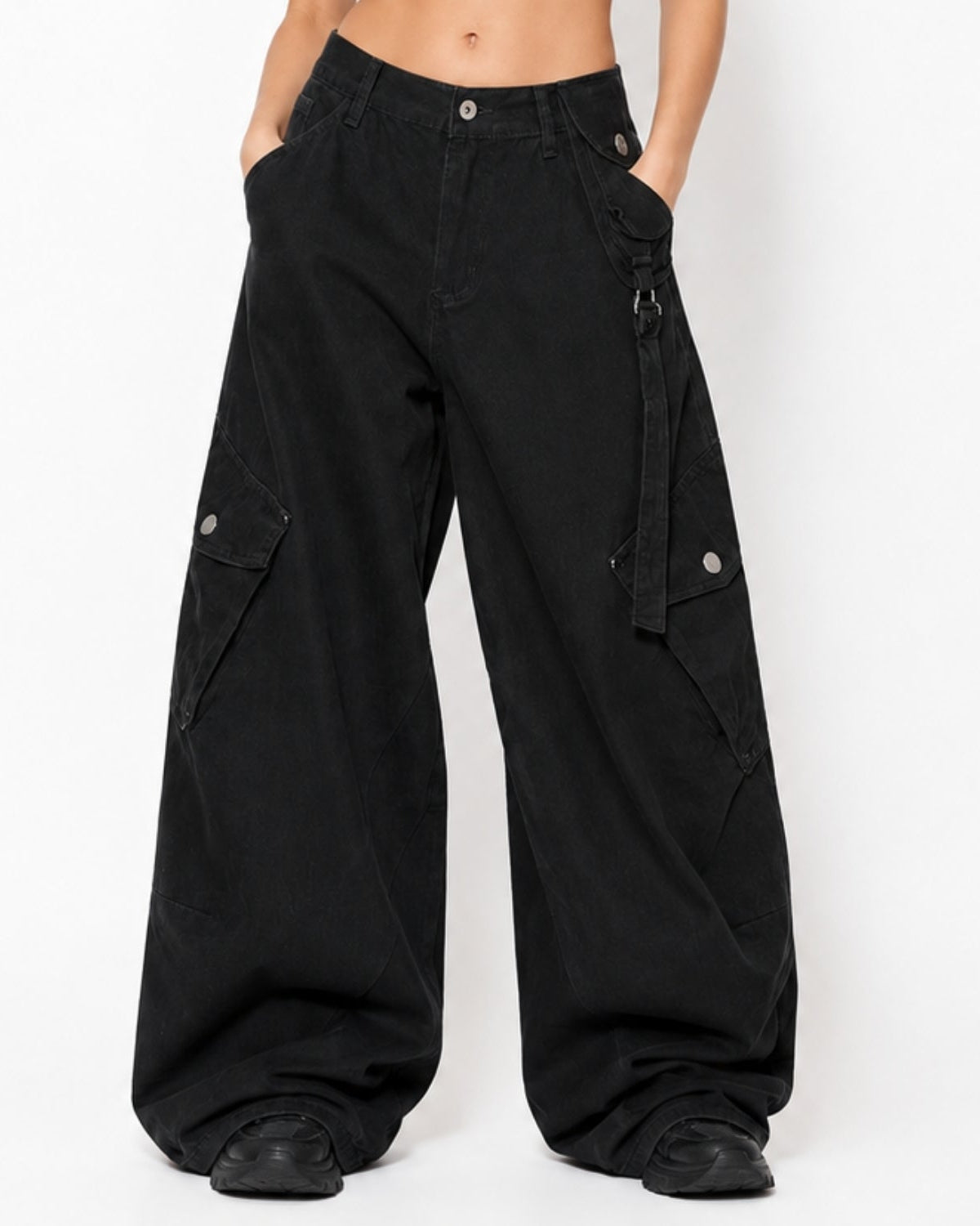 Black wide-leg cargo pants with multiple utility pockets and silver snap details, shown on a model against a plain white background.