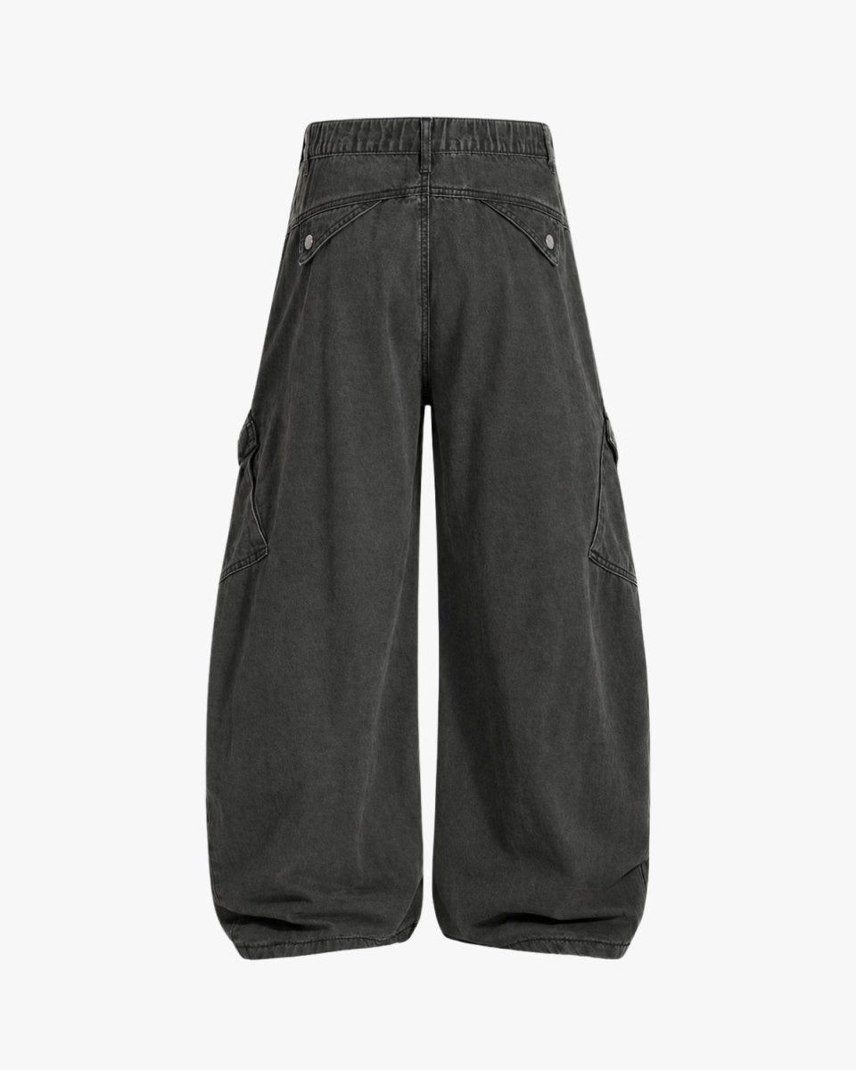 A pair of wide-leg cargo pants in washed black denim, shown from the back against a plain white background.