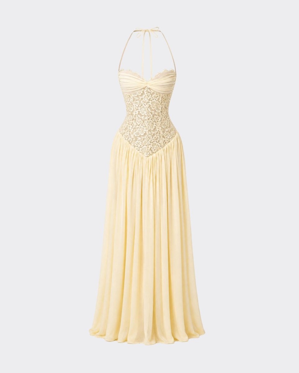 A pale yellow halter-neck maxi dress with a lace-embroidered corset bodice and a flowing chiffon skirt, shown against a light gray background.