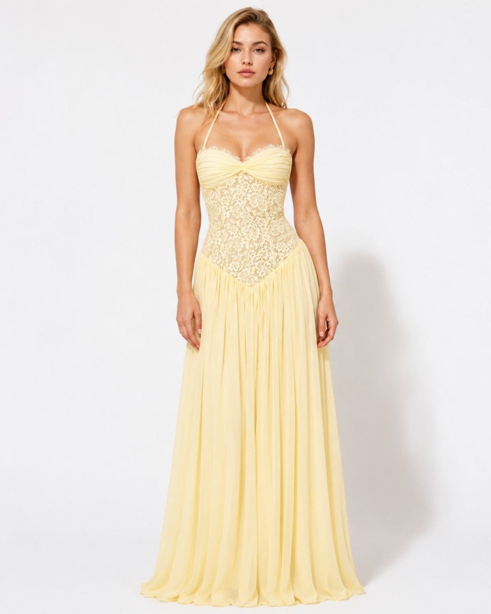 Woman modeling the pale yellow luxury maxi gown with a sweetheart lace bustier bodice and lightweight chiffon skirt.
