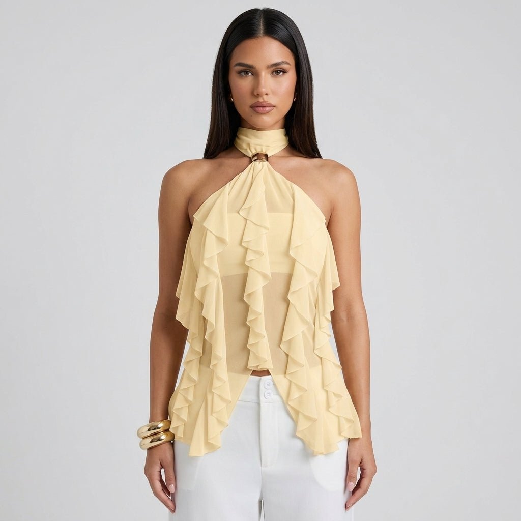 Close up studio shot of pale yellow sleeveless ruffle halter top highlighting the gold-tone metallic neck ring and draped fabric.