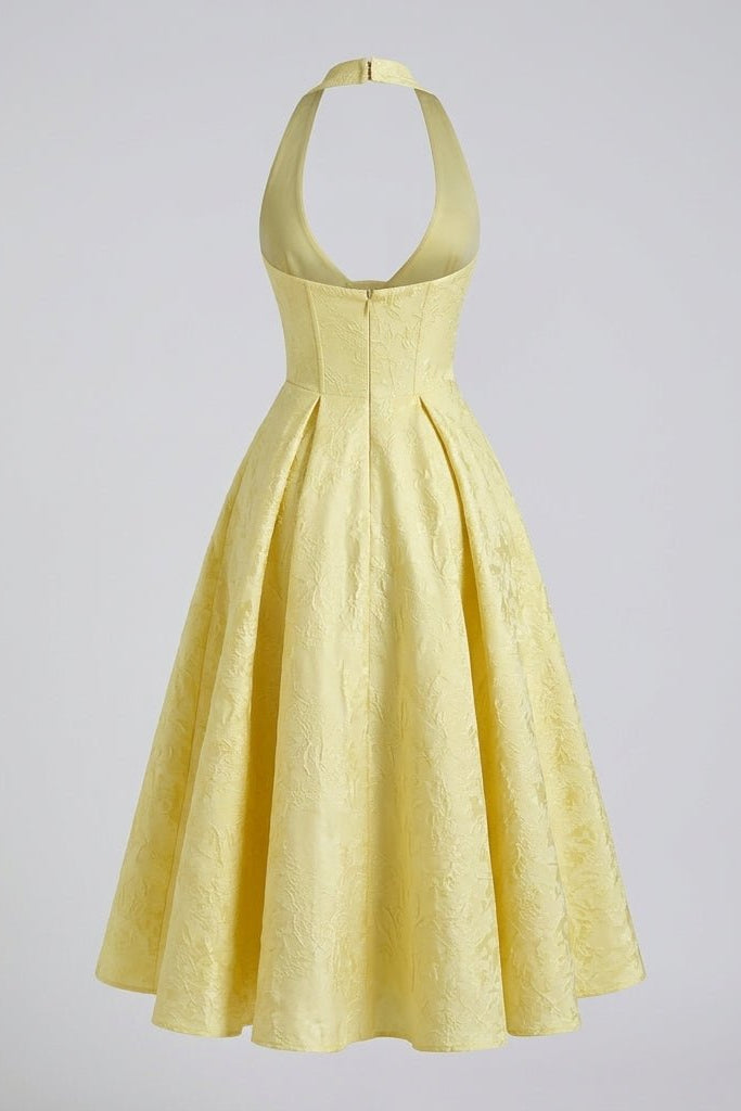 Ghost mannequin back view of the yellow halter neck dress showing the open back design and hidden zipper closure.