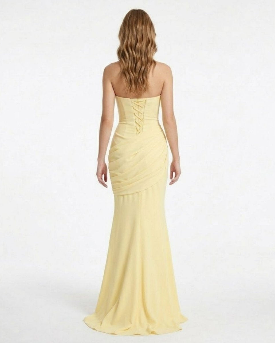 Back view of the Fenlo yellow prom dress showcasing the stunning open back with an adjustable lace-up corset closure.