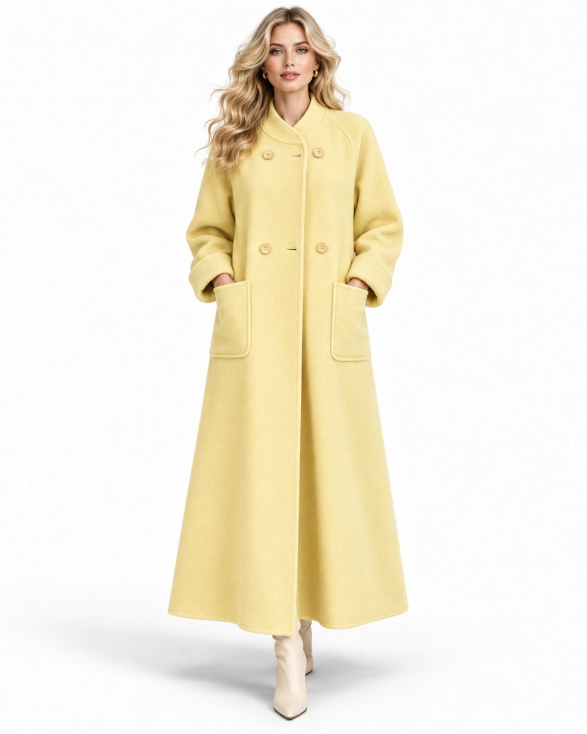 Front view of an elegant woman wearing a butter yellow longline luxury wool maxi coat with double breasted buttons and stand up collar.