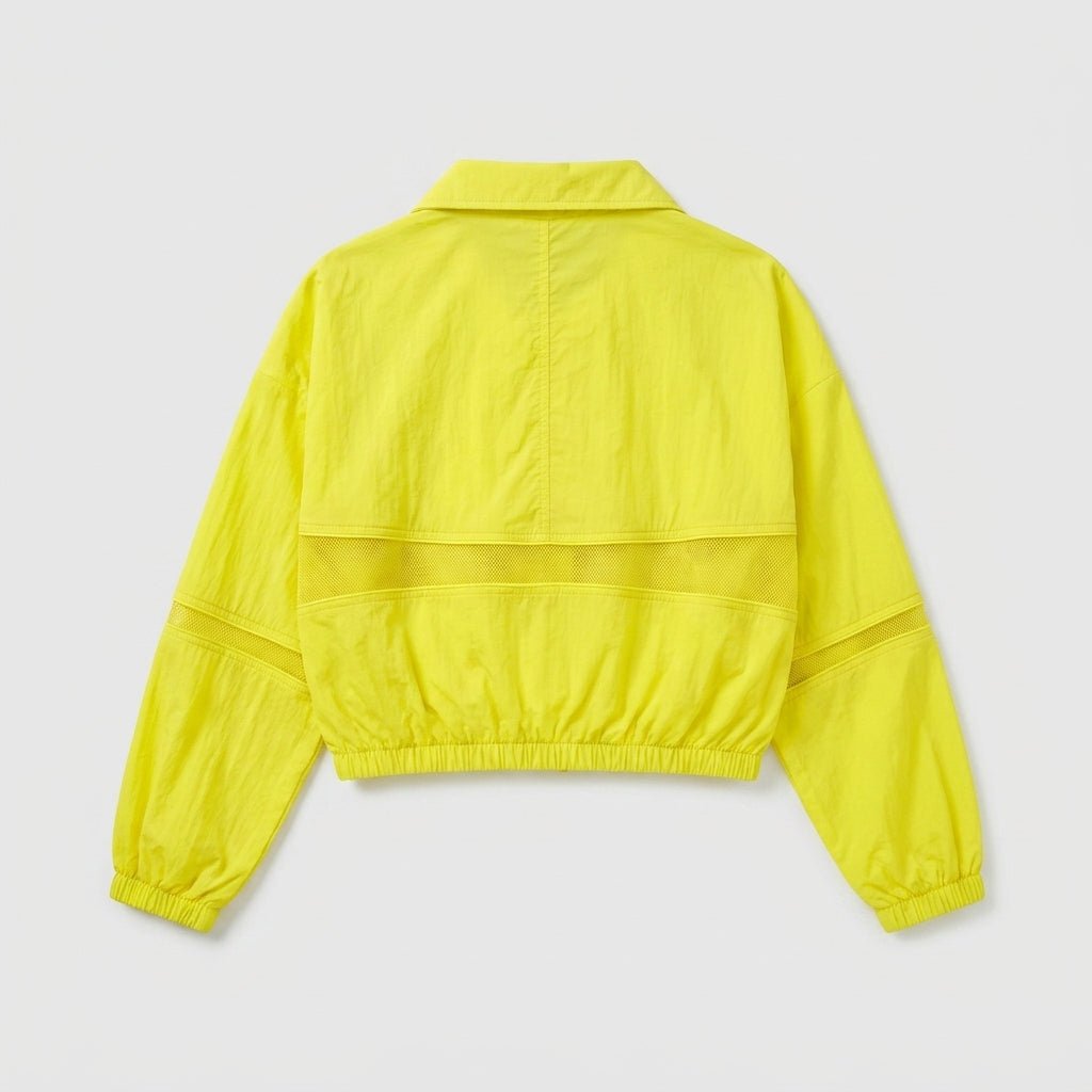 Back studio flat lay view of neon yellow lightweight women's windbreaker jacket with mesh back detailing.