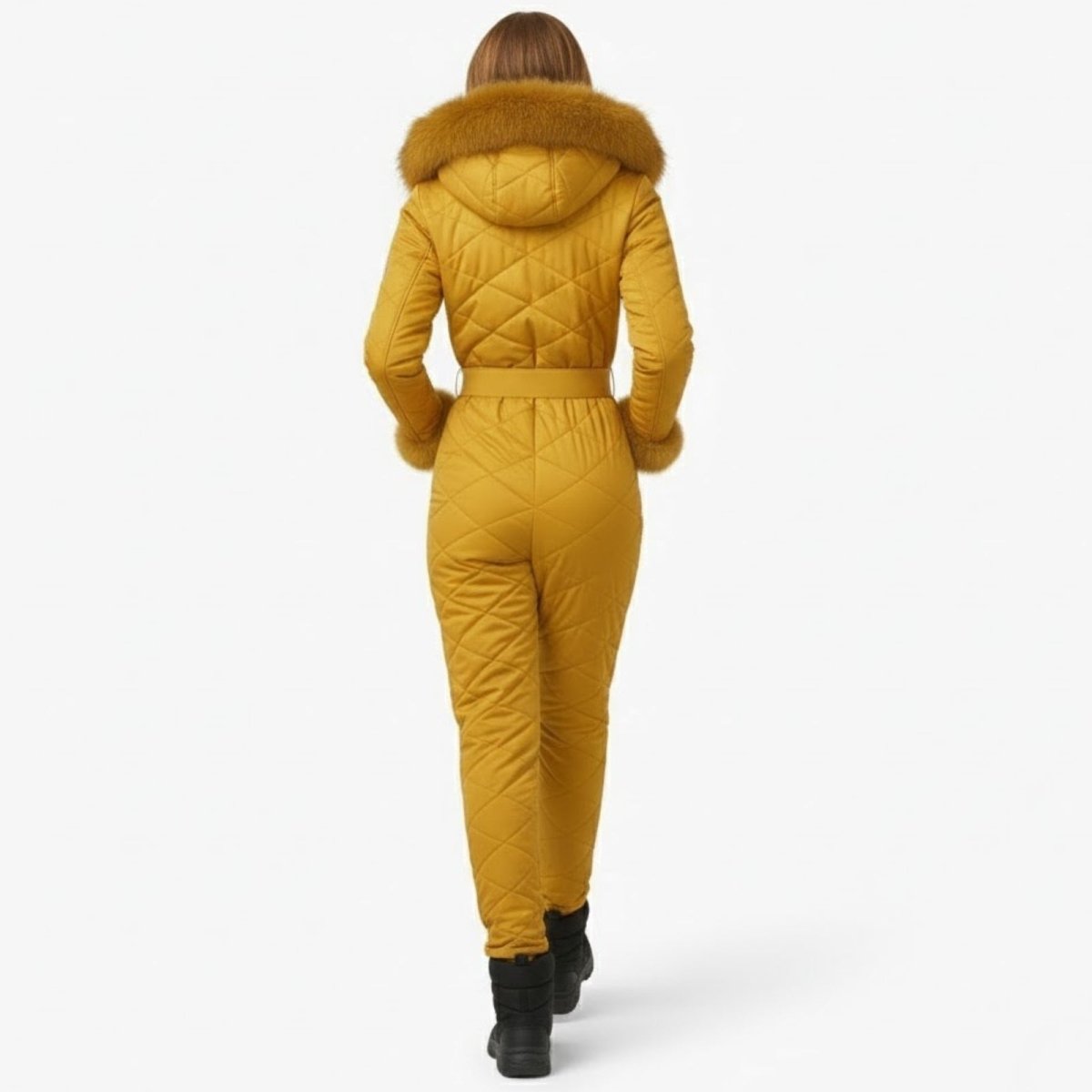 Back view of a model in the yellow one-piece snowsuit, highlighting the quilted pattern and belted waist.